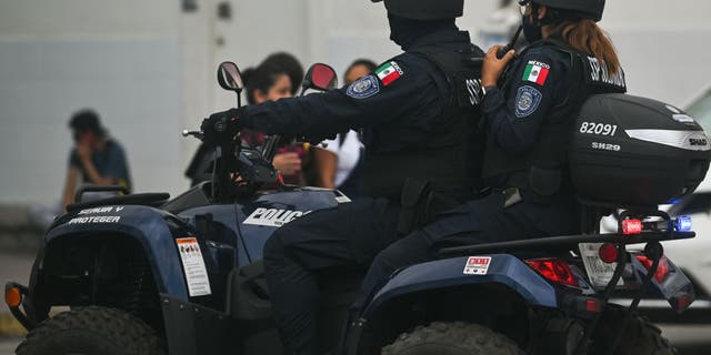 Members of the police on an ATV in Playa del Carmen, Quintana Roo, Mexico, Friday, April 29, 2022.