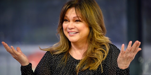 Valerie Bertinelli in a black sparkled top with her hands up in the air while on TODAY