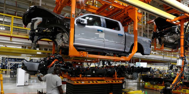 A Ford F-150 Lightning electric truck is assembled at Ford's Rouge Electric Vehicle Center in Dearborn, Michigan, on Sept. 20, 2022.