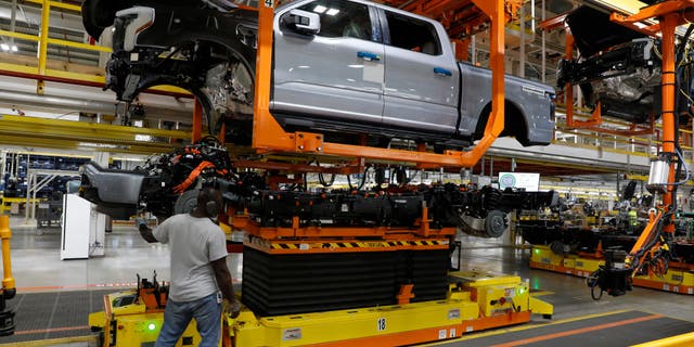 A Ford F-150 Lightning electric truck is assembled at Ford's Rouge Electric Vehicle Center in Dearborn, Michigan, on Sept. 20, 2022.