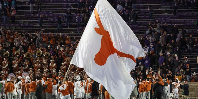 A giant Texas Longhorns flag flies to celebrate a win after a Big 12 college football game between the Texas Longhorns and Kansas State Wildcats Nov. 5, 2022, at Bill Snyder Family Stadium in Manhattan, Kan.