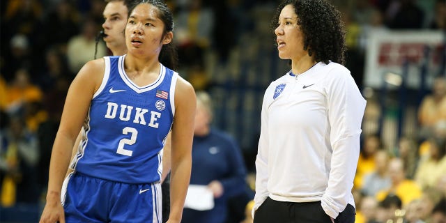Duke Blue Devils head coach Kara Lawson, right, talks to Duke Blue Devils guard Vanessa de Jesus, #2, during a regular season non-conference womens college basketball game between the Duke Blue Devils and the Toledo Rockets on Nov. 20, 2022 at Savage Arena in Toledo, Ohio.