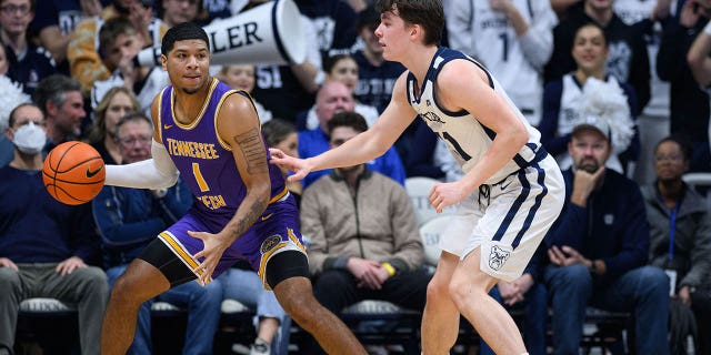 Tennessee Tech Golden Eagles guard Diante Wood (1) backs into the lane against Butler Bulldogs guard Simas Lukosius (41) during the men's college basketball game between the Butler Bulldogs and Tennessee Tech Golden Eagles on December 3, 2022, at Hinkle Fieldhouse in Indianapolis, IN.