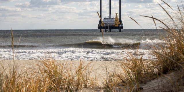 A lift boat off the beach near Wainscott, New York, US, on Thursday, Dec. 1, 2022. The vessel's drill will be used in the construction of the South Fork Wind farm that will bore tunnels to bring electricity from the offshore wind farm that should start generating power in late 2023. Photographer: Johnny Milano/Bloomberg via Getty Images