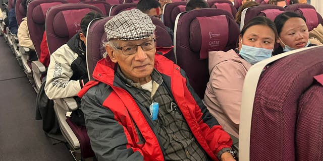French serial killer Charles Sobhraj sits in an aircraft from Kathmandu to France, on December 23, 2022.