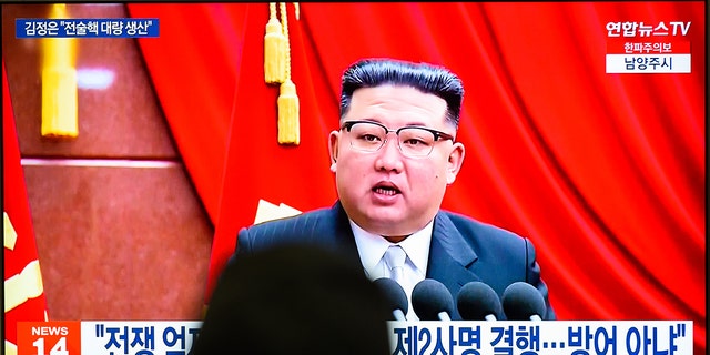A TV screen shows footage of North Korean leader Kim Jong-un during a news program at the Yongsan Railway Station in Seoul. 