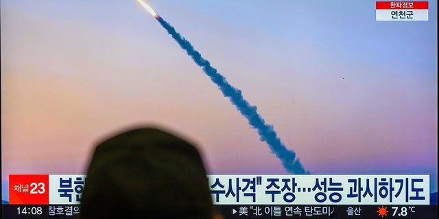 A TV screen shows a footage of North Korea's missile launch during a news program at the Yongsan Railway Station in Seoul. 