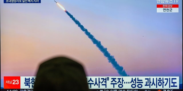 A TV screen shows a footage of North Korea's missile launch during a news program at the Yongsan Railway Station in Seoul. 