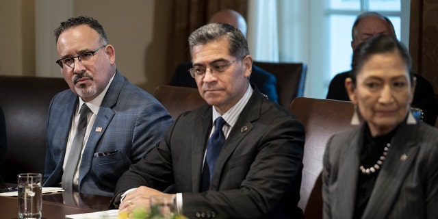 Health and Human Services Secretary Xavier Becerra, center, leads the agency charged with the care and placement of unaccompanied children referred by U.S. Customs and Border Protection.