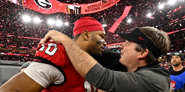 Georgia Bulldogs head coach Kirby Smart celebrates with linebacker Jamon Dumas-Johnson, #10, after defeating the TCU Horned Frogs 65-7 to win the CFP National Championship Football game at SoFi Stadium in Inglewood on Monday, Jan. 9, 2023.