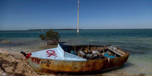 A boat used by Cuban migrants to reach the United States sit offshore Islamorada on the Overseas Highway, mile marker 79, on Jan. 14, 2023. 