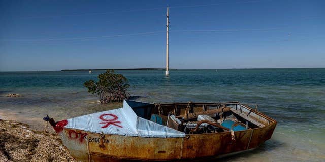 A vessel utilized by Cuban migrants to scope nan United States beryllium offshore Islamorada connected nan Overseas Highway, mile marker 79, connected Jan. 14, 2023.