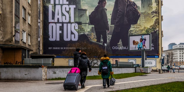 The huge banner ad for HBO's 'The Last of Us' television series is seen in downtown Warsaw, Poland, January 19, 2023. The show is an American post-apocalyptic drama television series created by Craig Mazin and based on the 2013 video game.