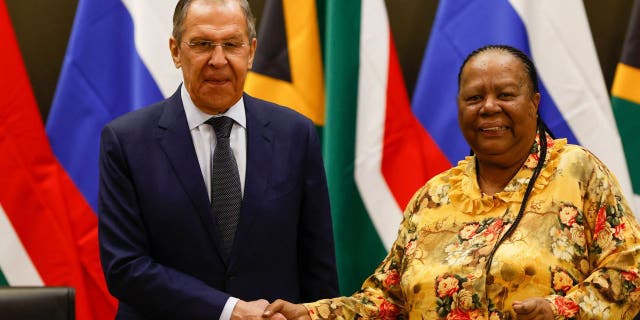 Russian Minister of Foreign Affairs of Sergei Lavrov (L) shakes hands with South African Minister of International Relations and Cooperation Naledi Pandor (R) during a press conference following their meeting at the OR Tambo Building in Pretoria on January 23, 2023.