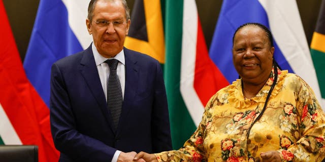 Russian Minister of Foreign Affairs of Sergei Lavrov (L) shakes hands with South African Minister of International Relations and Cooperation Naledi Pandor (R) during a press conference following their meeting at the OR Tambo Building in Pretoria on January 23, 2023. 