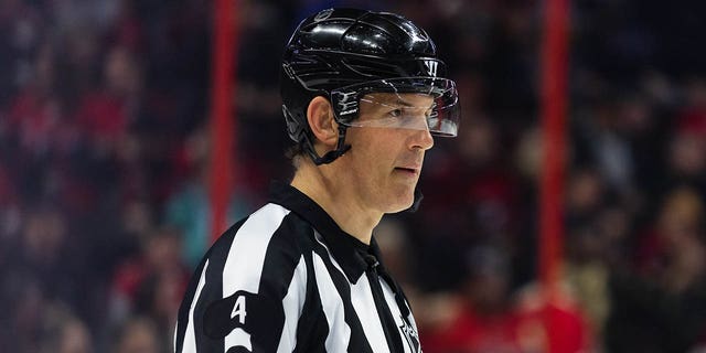 Referee Wes McCauley is pictured during a game between the Montreal Canadiens and the Ottawa Senators on January 28, 2023 at the Canadian Tire Center in Ottawa, Ontario, Canada.