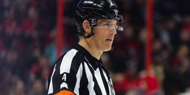 Referee Wes McCauley is pictured during a game between the Montreal Canadiens and the Ottawa Senators on January 28, 2023 at the Canadian Tire Center in Ottawa, Ontario, Canada.