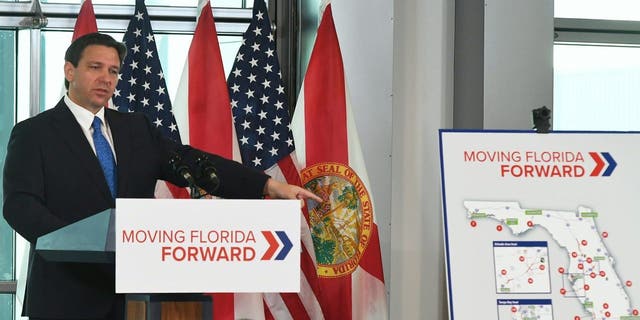 Florida Gov. Ron DeSantis holds a press conference to announce the Moving Florida Forward initiative at the SunTrax Test Facility in Auburndale, Florida.