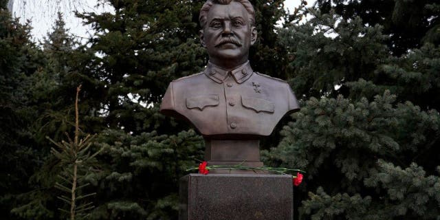 A picture shows the newly unveiled bronze bust of Soviet leader Joseph Stalin outside the museum dedicated to the Battle of Stalingrad in the southern Russian city of Volgograd on Feb. 1, 2023, on the eve of commemorations of the Soviet victory in the Stalingrad battle.