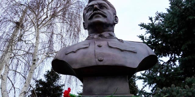 A picture shows the newly unveiled bronze bust of Soviet leader Joseph Stalin outside the museum dedicated to the Battle of Stalingrad in the southern Russian city of Volgograd on Feb. 1, 2023, on the eve of commemorations of the Soviet victory in the Stalingrad battle.