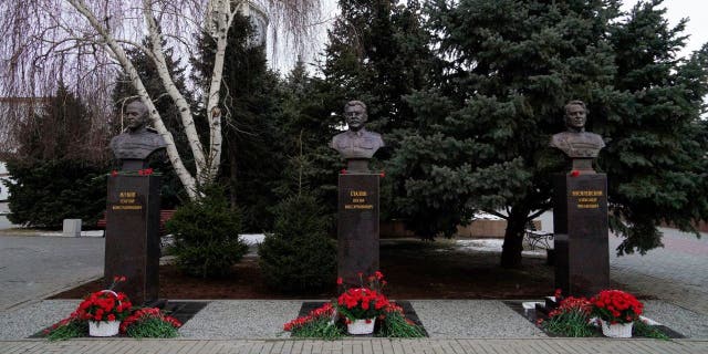 A picture shows the newly unveiled bronze busts of Soviet Marshals Georgy Zhukov, left, and Alexander Vasilevsky, right, and Soviet leader Joseph Stalin outside the museum dedicated to the Battle of Stalingrad in the southern Russian city of Volgograd on Feb. 1, 2023, on the eve of commemorations of the Soviet victory in the Stalingrad battle.