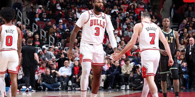 Andre Drummond (3) of the Chicago Bulls high-fives Goran Dragic (7) during a game against the Indiana Pacers Feb. 2, 2023, at United Center in Chicago.