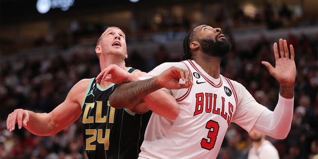 Charlotte Hornets center Mason Plumlee, #24, and Chicago Bulls center Andre Drummond, #3, battle for position under the basket during an NBA game between the Charlotte Hornets and the Chicago Bulls on February 2, 2023 at the United Center in Chicago.