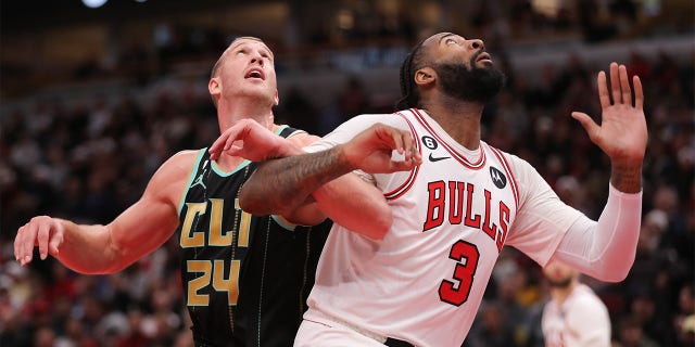 Charlotte Hornets center Mason Plumlee, #24, and Chicago Bulls center Andre Drummond, #3, battle for position under the basket during an NBA game between the Charlotte Hornets and the Chicago Bulls on February 2, 2023 at the United Center in Chicago.