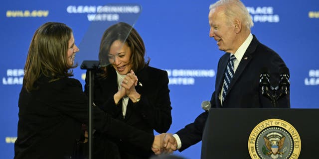 US Vice President Kamala Harris (C), Jana Curtis (L), Founder of Get the Lead Out Riverwards and US President Joe Biden look on at Belmont Water Treatment Center in Philadelphia, Pennsylvania, on February 3, 2023. 