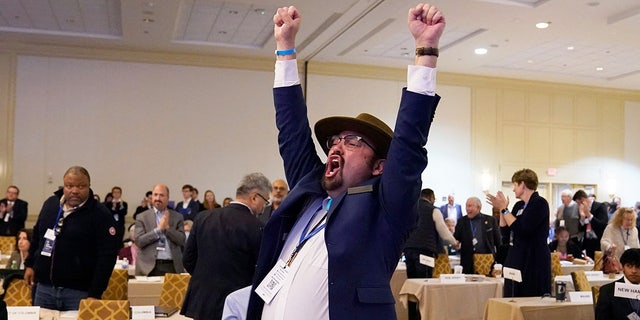 Manny Crespin, vice chair of the Democratic Party of New Mexico cheers after a vote at the Democratic National Committee Winter Meeting on its Rules and Bylaws Committees recommendation to reorder the presidential primary calendar in 2024, in Philadelphia, Pennsylvania, on February 4, 2023.