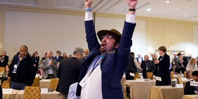 Manny Crespin, vice chair of the Democratic Party of New Mexico cheers after a vote at the Democratic National Committee Winter Meeting on its Rules and Bylaws Committees recommendation to reorder the presidential primary calendar in 2024, in Philadelphia, Pennsylvania, on February 4, 2023.