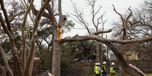 Lineman crews work to restore power to neighborhoods following a winter storm in Austin, Texas, US, on Friday, Feb 3, 2023.