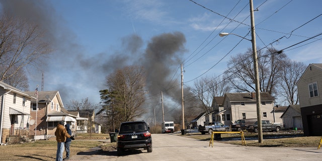 Smoke rises from a derailed cargo train in East Palestine, Ohio, on February 4, 2023. 