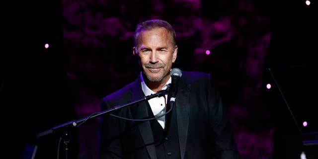 Kevin Costner speaks on-stage during the Recording Academy and Clive Davis Pre-Grammy Gala.
