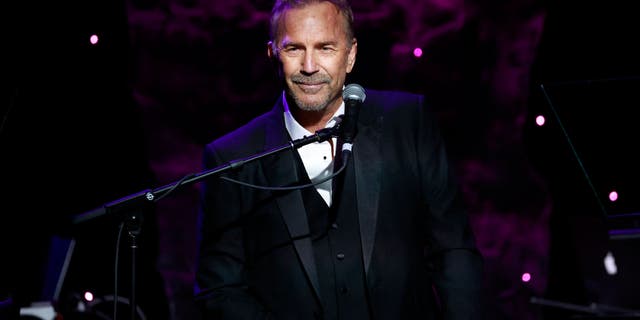 Kevin Costner speaks on-stage during the Recording Academy and Clive Davis Pre-Grammy Gala.