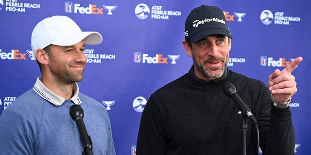 Green Bay Packers quarterback, Aaron Rodgers and his playing partner, Ben Silverman, talk to the media during the continuation of the third round of the AT&T Pebble Beach Pro-Am at Pebble Beach Golf Links on February 5, 2023 in Pebble Beach, California.