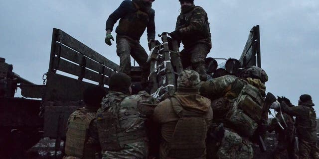 Ukrainian troops load 203 mm Pion artillery shells into a truck Feb. 2, 2023 after completion of a fire mission. Artillery continues to play an important role in the defense against the Russian invasion. 