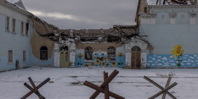 Paintings are seen on a wall of a heavily damaged during Russian attacks House of Culture, on Feb 7, 2023 in Irpin, Ukraine.