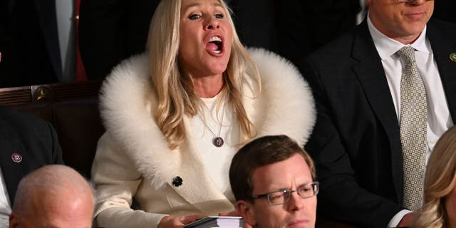 US Republican Representative Marjorie Taylor Greene (R-GA) yells as US President Joe Biden delivers the State of the Union address at the US Capitol in Washington, DC, February 7, 2023.