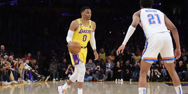 Russell Westbrook (0) of the Los Angeles Lakers dribbles the ball during a game against the Oklahoma City Thunder Feb. 7, 2023, at Crypto.Com Arena in Los Angeles.
