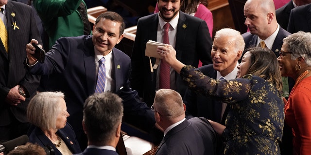 President Biden takes photographs with members of Congress after speaking during a State of the Union address at the US Capitol in Washington, D.C., on Tuesday, Feb. 7, 2023. 