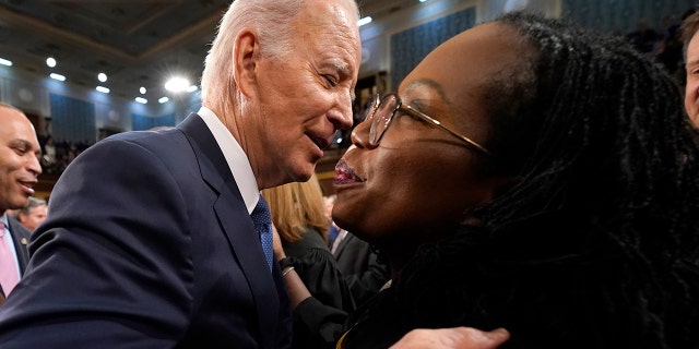 U.S. President Joe Biden hugs Supreme Court Justice Ketanji Brown Jackson before the State of the Union address to a joint session of Congress on February 7, 2023, in the House Chamber of the U.S. Capitol in Washington, DC. 