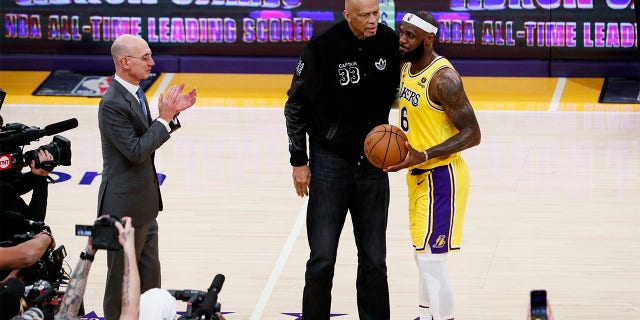 LeBron James, right, hugs Kareem Abdul-Jabbar after becoming the all-time NBA scoring leader, passing Abdul-Jabbar with 38,388 points during the third quarter against the Oklahoma City Thunder at Crypto.com Arena Tuesday, Feb. 7, 2023, in Los Angeles.
