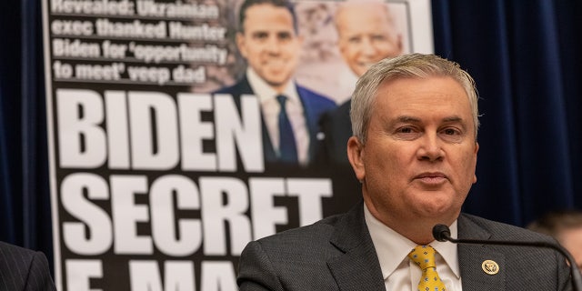 Comer in front of billboard of New York Post Hunter Biden frontpage