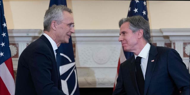 NATO Secretary General Jens Stoltenberg and US Secretary of State Antony Blinken shake hands after a press conference in the Benjamin Franklin Room of the State Department in Washington, DC, on Feb. 8, 2023.