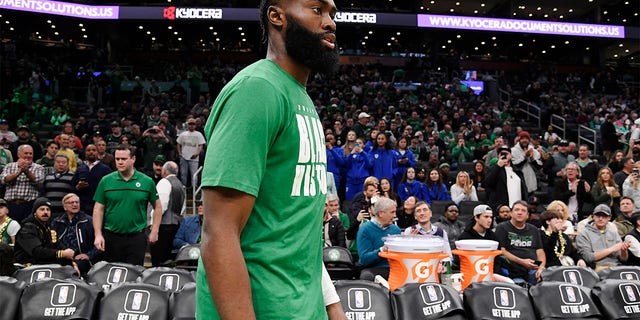 Jaylen Brown, number 7 of the Boston Celtics, looks on before the game against the Philadelphia 76ers on February 8, 2023 at TD Garden in Boston.