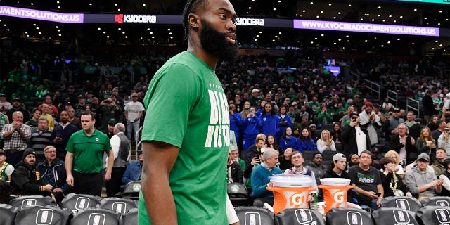 Jaylen Brown, number 7 of the Boston Celtics, looks on before the game against the Philadelphia 76ers on February 8, 2023 at TD Garden in Boston.