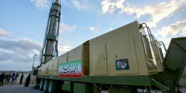 Demonstration of the Iranian Ghadr long-range missile "Down with Israel" depicted in Hebrew at a defense exhibition in the city of Isfahan, central Iran, February 8, 2023. 