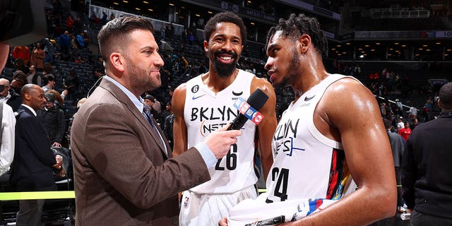 Cam Thomas of the Brooklyn Nets, right, is interviewed after the game against the Chicago Bulls at Barclays Center in New York City on Thursday.