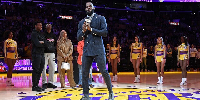 LeBron James of the Lakers talks to the crowd during a ceremony to honor him becoming the all-time leading scorer before the game against the Milwaukee Bucks on Feb. 9, 2023, at Crypto.Com Arena in Los Angeles.